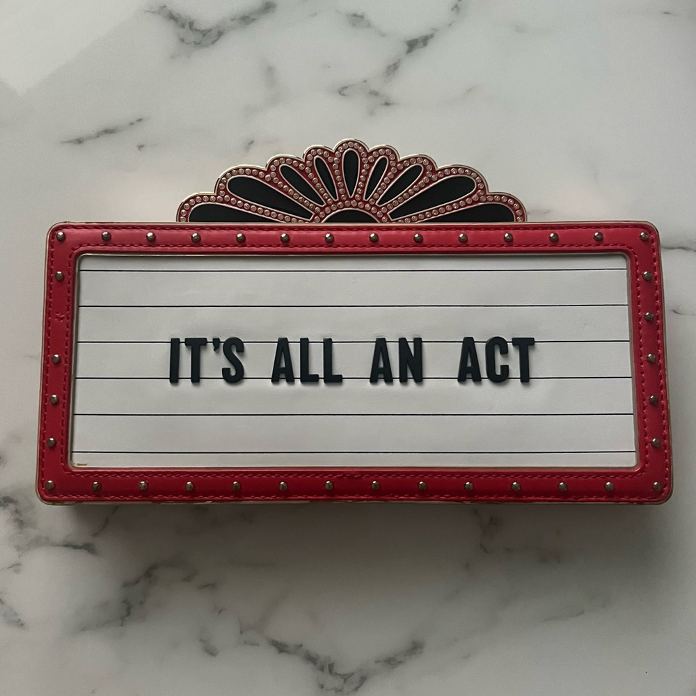 ‘It’s All An Act’ Kate Spade dress the part marquee clutch